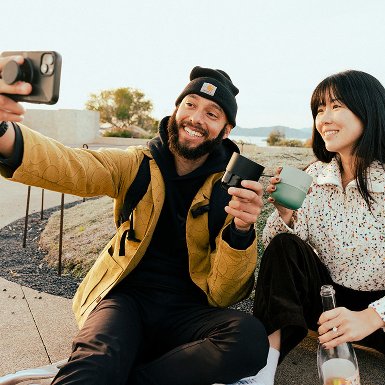 Friends carrying reusable cups